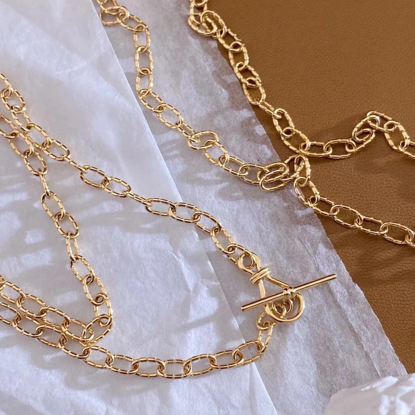 Collier chaîne torsadée à motif dappé