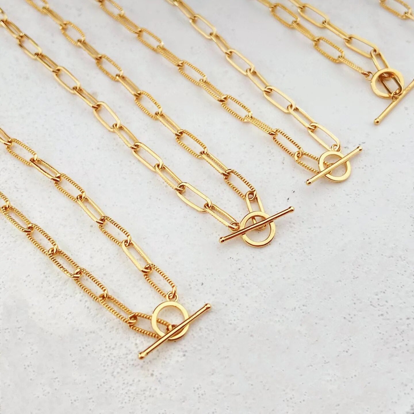 Collier barre en T à chaîne étirée moletée
