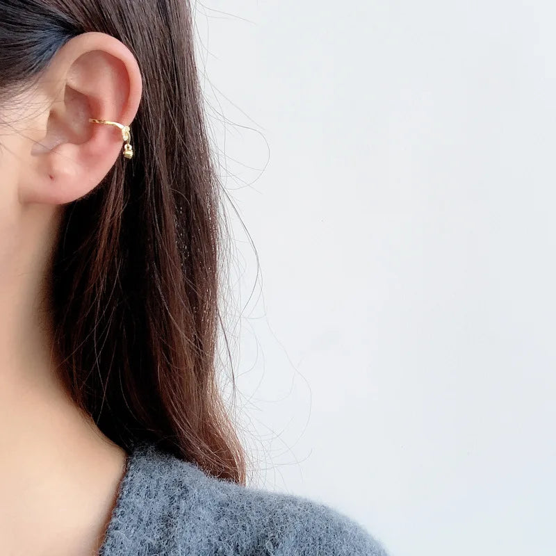Boucle d'oreille clip nœud pavé E1010, 1 pièce
