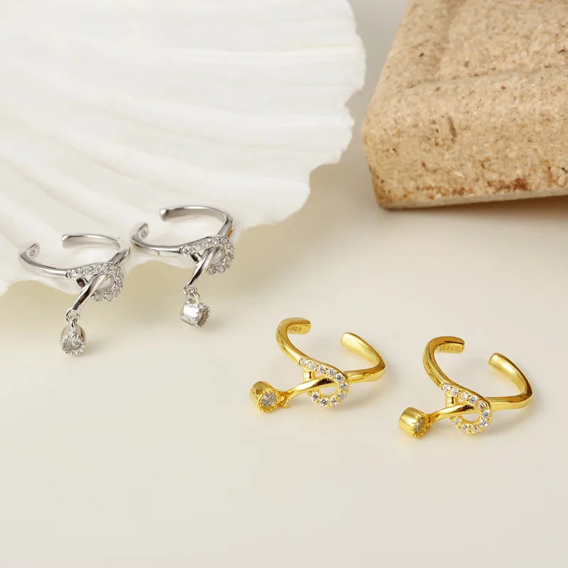 Boucle d'oreille clip nœud pavé E1010, 1 pièce