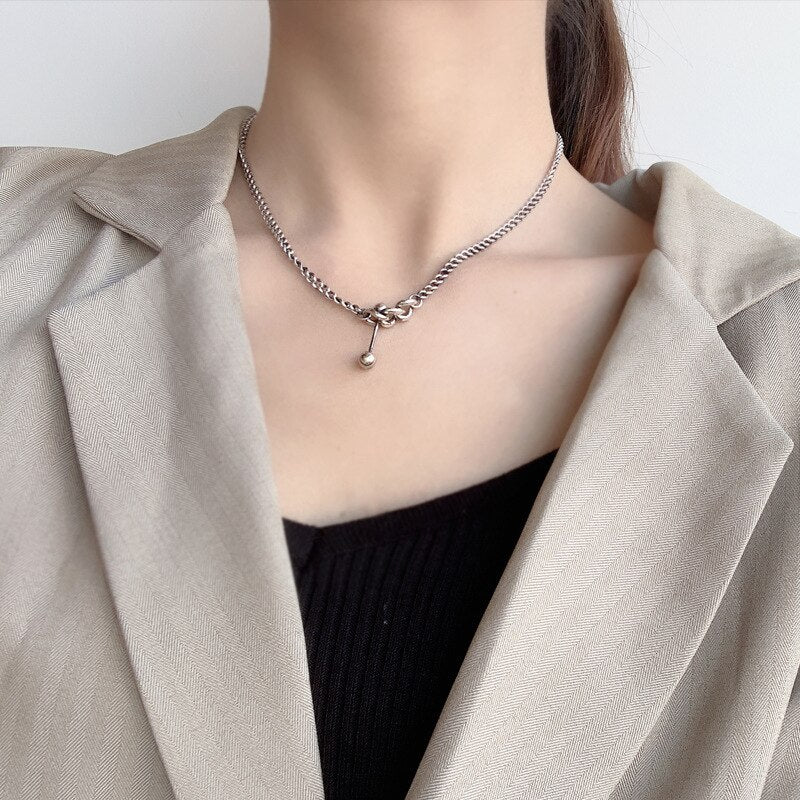 Collier chaîne gourmette à breloque haltère N1008