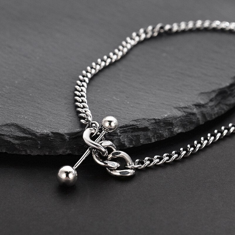 Collier chaîne gourmette à breloque haltère N1008