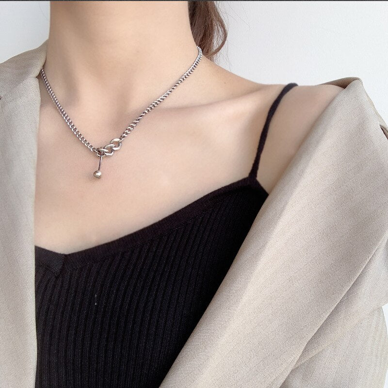 Collier chaîne gourmette à breloque haltère N1008