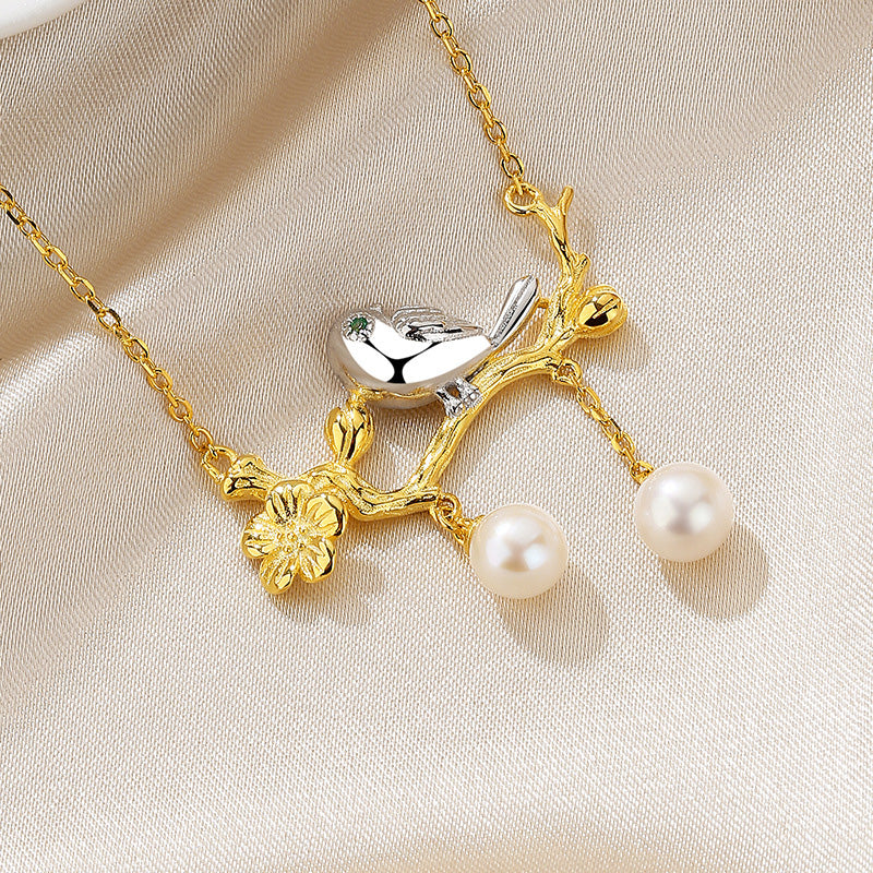 Collier oiseau de perles d'eau douce sur un brindille PN1029