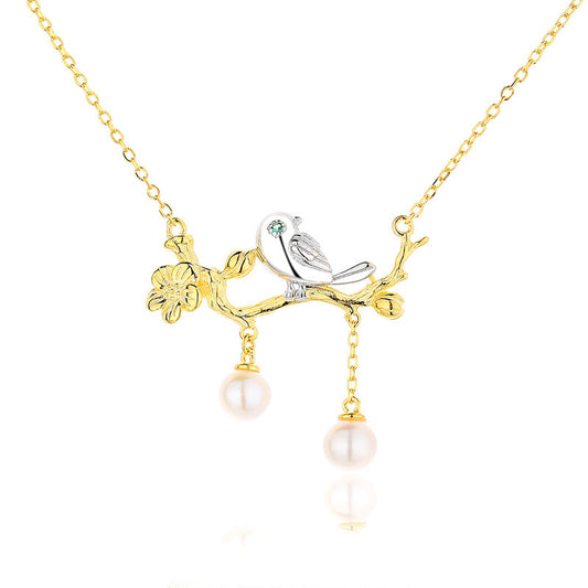 Collier oiseau de perles d'eau douce sur un brindille PN1029