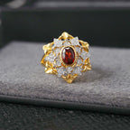 Bague ajourée florale grenat 6364