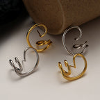 Clous d'oreilles à motif de fil abstrait E1029