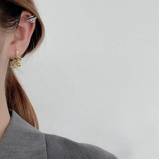 Boucles d'oreilles créoles à plis irréguliers E1042