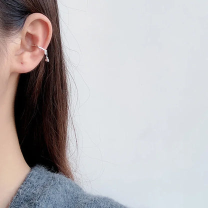 Boucle d'oreille clip nœud pavé E1010, 1 pièce