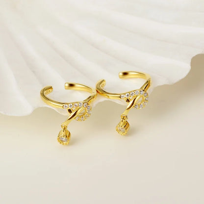 Boucle d'oreille clip nœud pavé E1010, 1 pièce