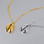 Pendentif coquille de trompette de conque N1012