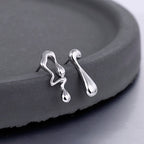 Boucles D'oreilles Puces Liquides Ondulées E1155
