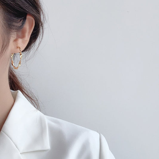 Boucles d'oreilles créoles en fil torsadé E1043