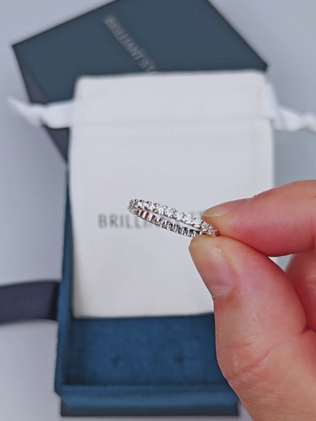 Round Stone Scalloped Eternity Ring