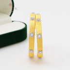 Boucles d'oreilles créoles étoiles en soie 5482