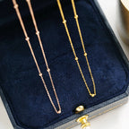 Collier chaîne chapelet satellite perles Saturne